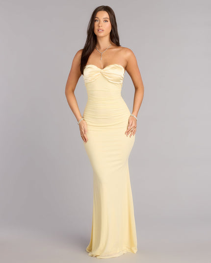 Own Prom 2026 in the Iris Satin Tie-Back Mesh Mermaid Dress,  a yellow prom dress designed with a flattering silhouette and elevated details that feel modern and true to your style.